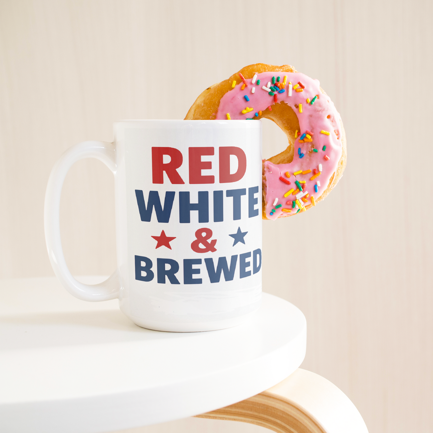 Red_White_and_Brewed__Patriotic_Coff_15ozWhiteMugLifetsyleDonutLH_Mockup.png