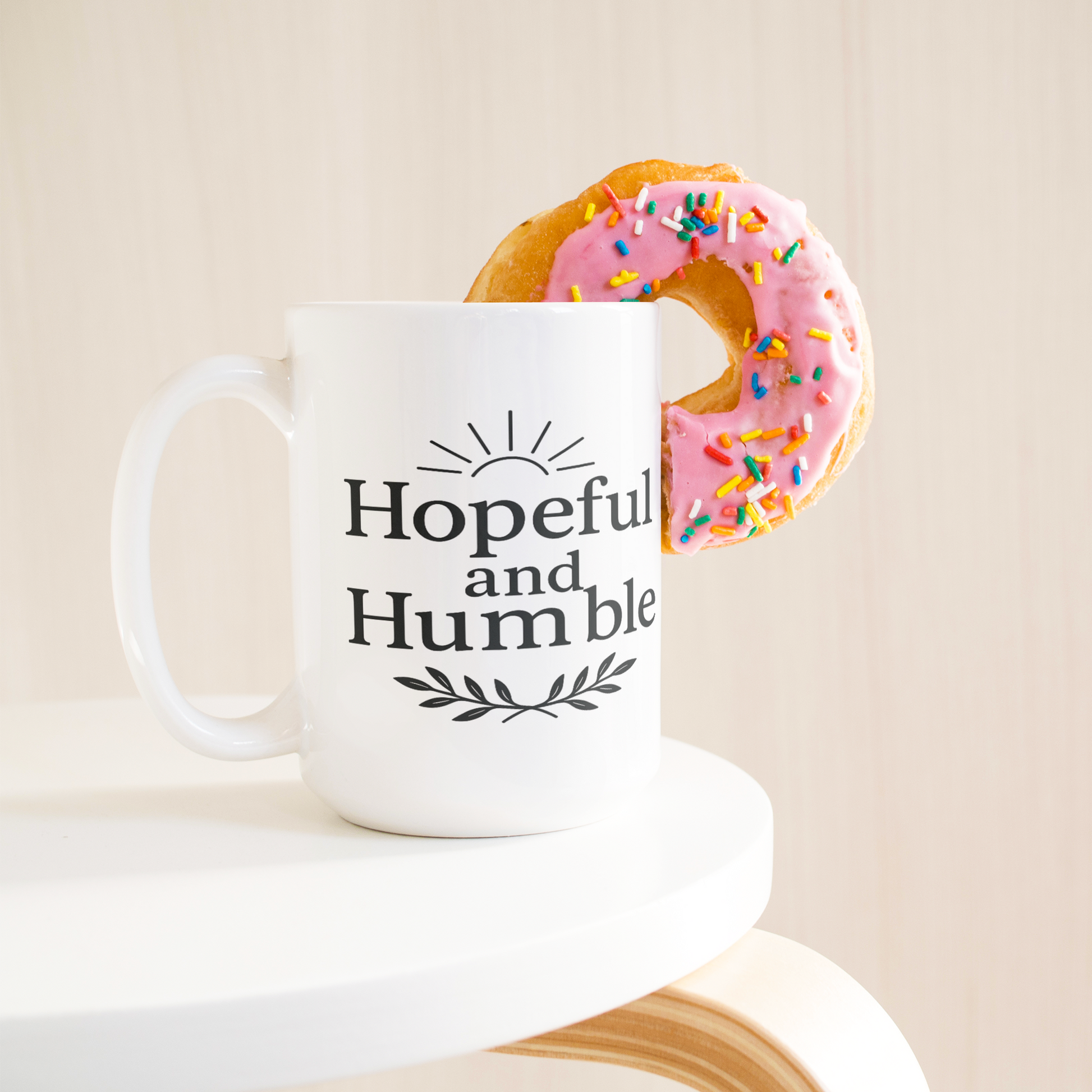 Hopeful_and_Humble_Mug_15ozWhiteMugLifetsyleDonutLH_Mockup.png