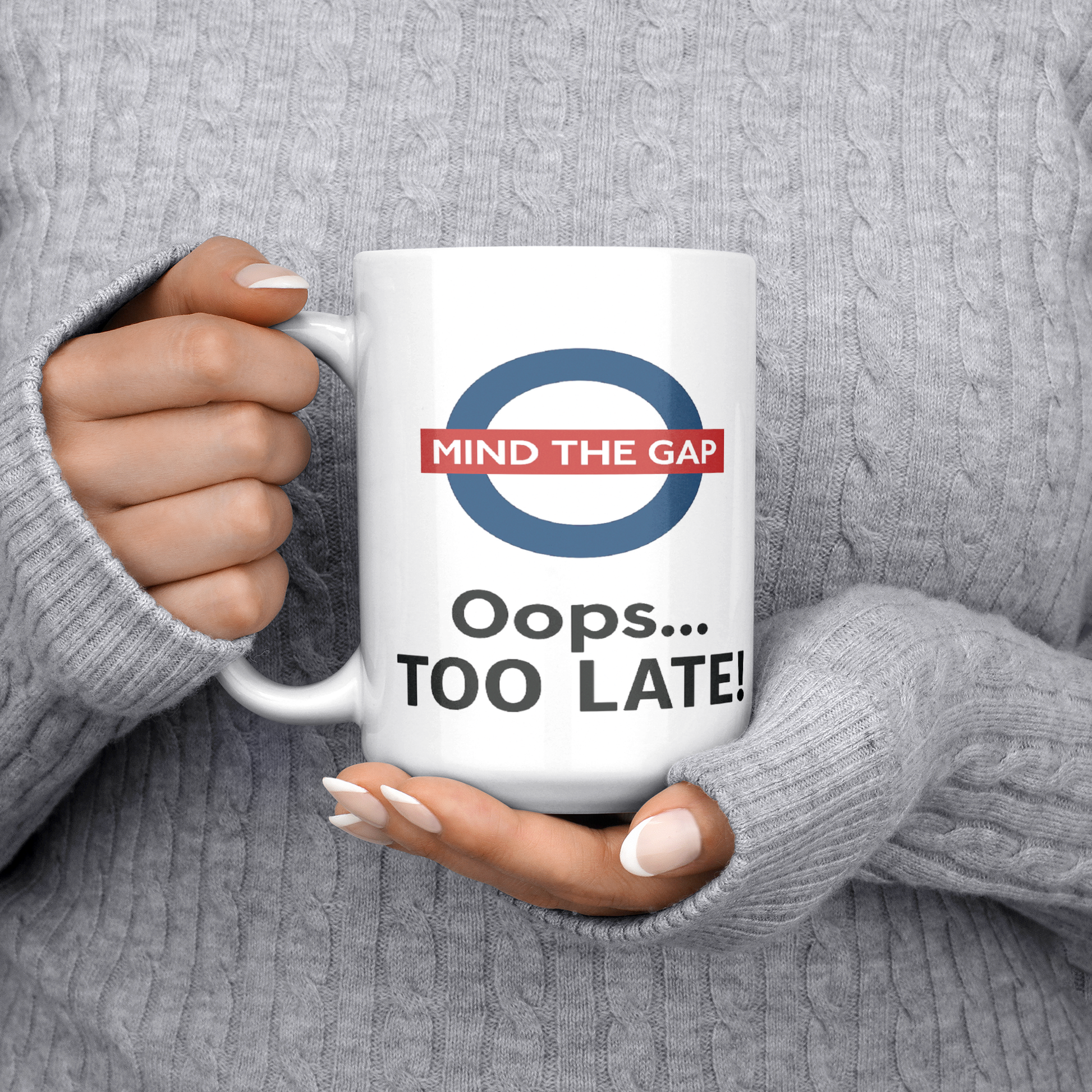 Mind_the_Gap_Oops_Too_Late_Funny__15ozWhiteMugLifestyleLHChest_Mockup.png