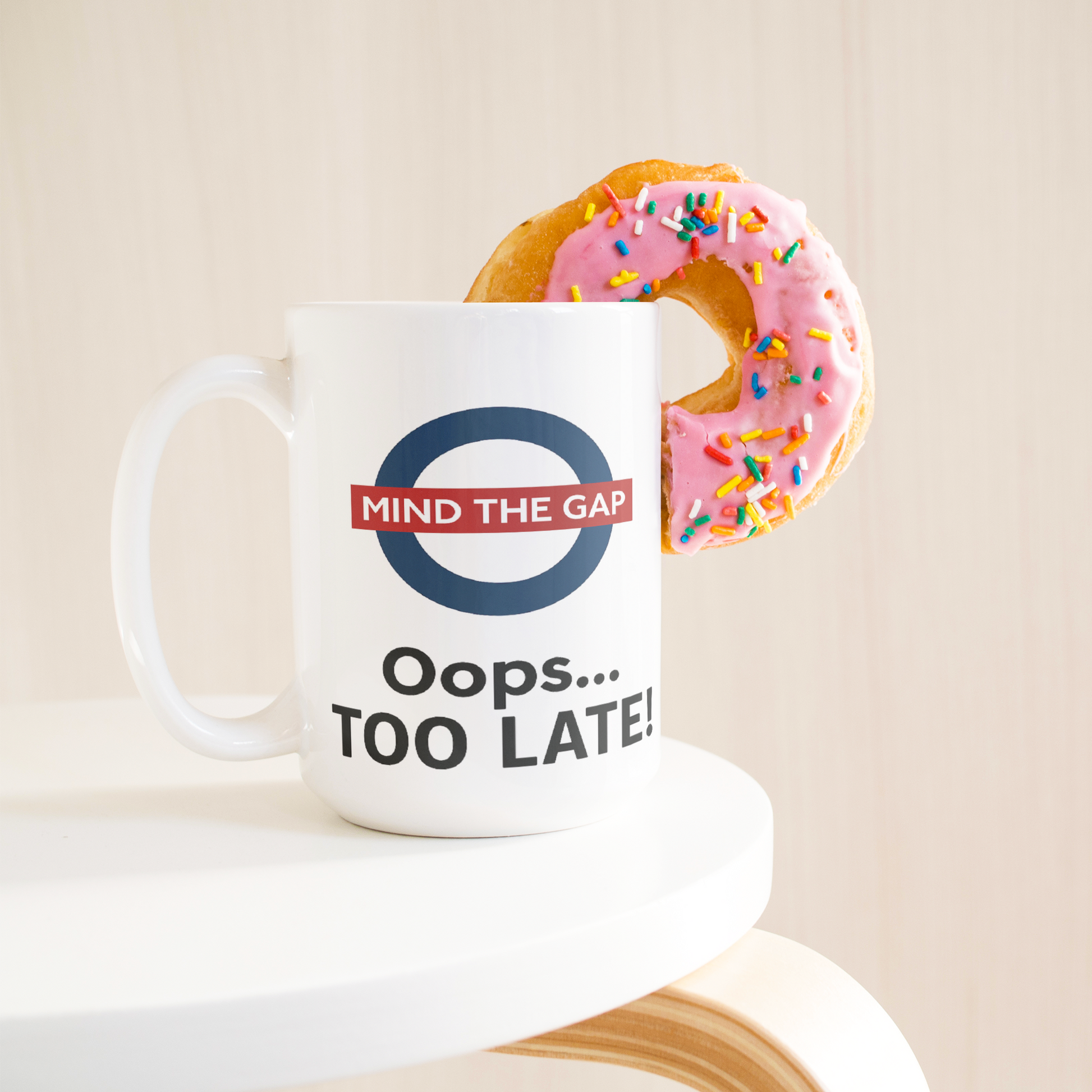 Mind_the_Gap_Oops_Too_Late_Funny__15ozWhiteMugLifetsyleDonutLH_Mockup.png