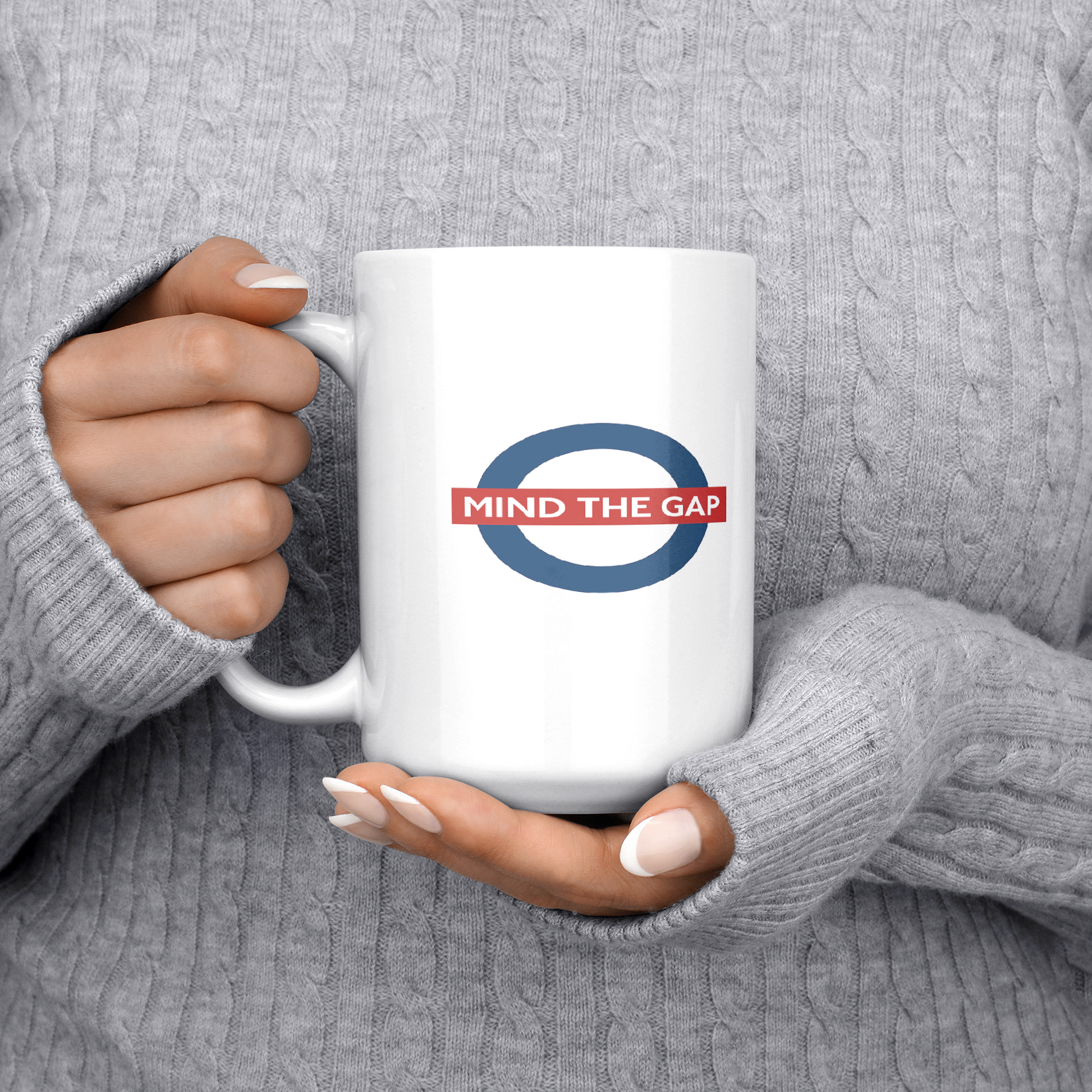 Mind_the_gap_humorous_British_saying_mug_15ozWhiteMugLifestyleLHChest_Mockup.png